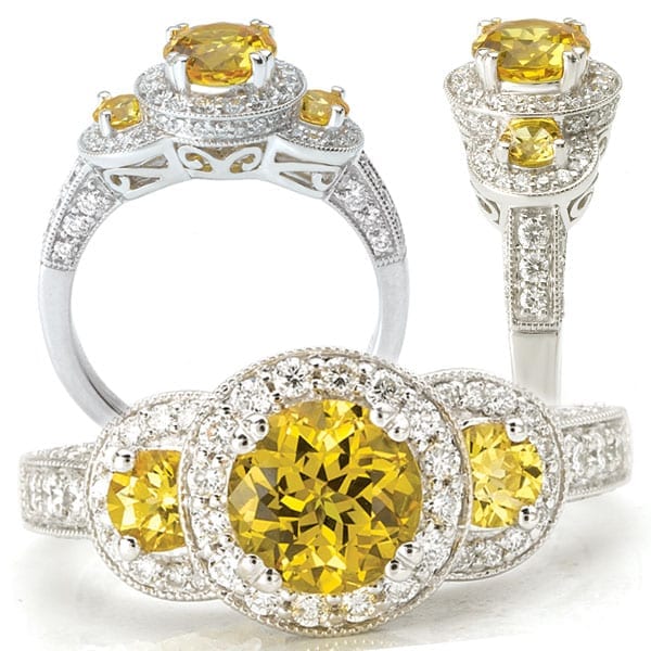 Three stone yellow sapphire and diamond halo engagement ring